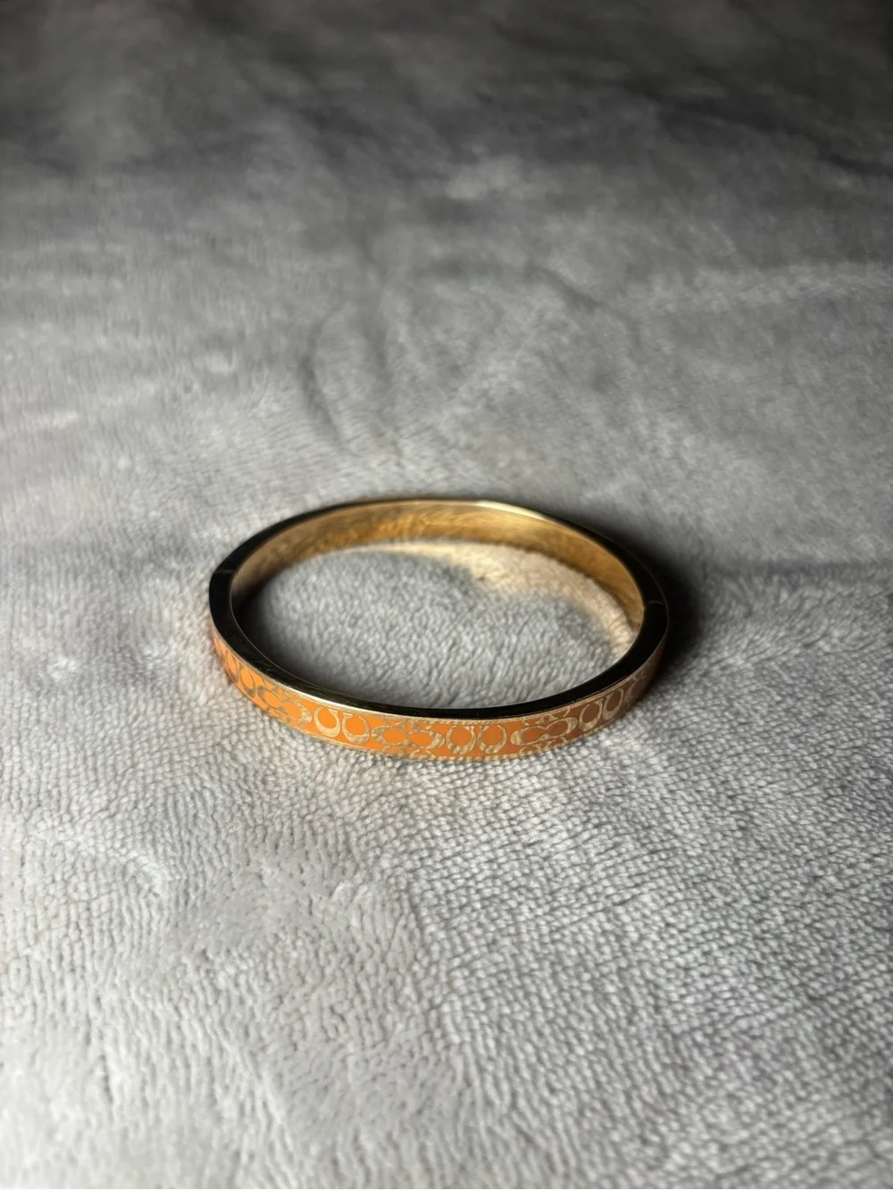 Coach Signature Enamel Orange and Gold Thin Bangle